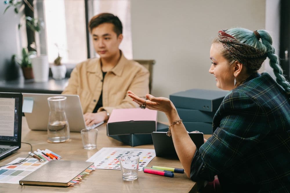 Creative agency team planning a branded product offering together at a desk
